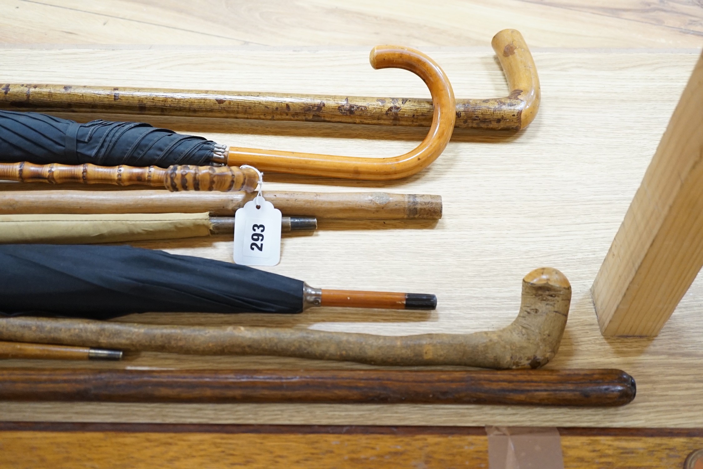 Four umbrellas and four walking sticks
